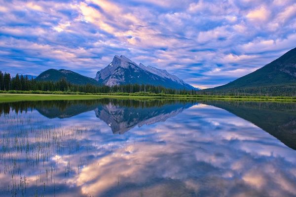 Canada-Alberta-Banff National Park Reflections in lake at sunrise